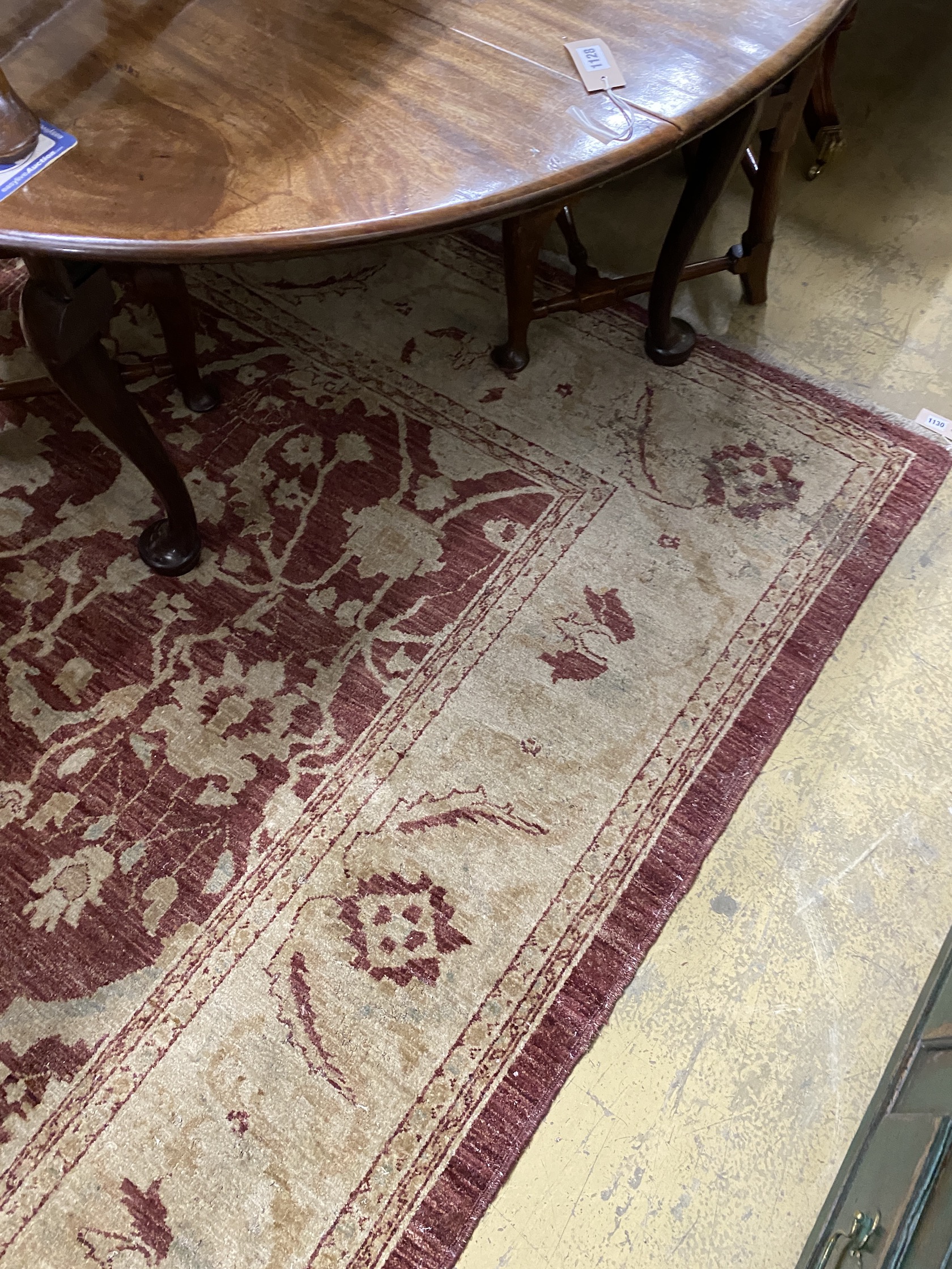 A Zeigler style burgundy ground carpet, 306 x 245cm